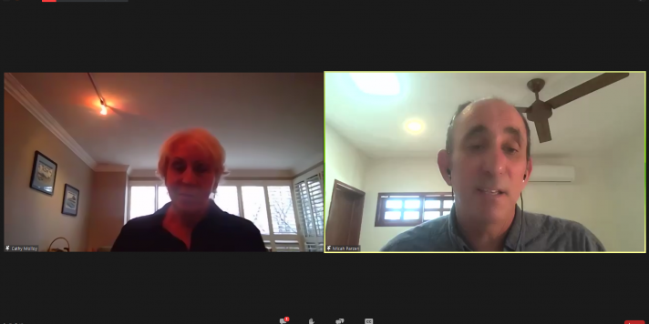 Cathy Molloy on the left, Micah Parzen on the right. Screenshot of Zoom. Micah Parzen is speaking. 