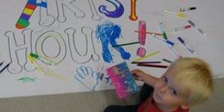Child painting Artsy Hour sigan