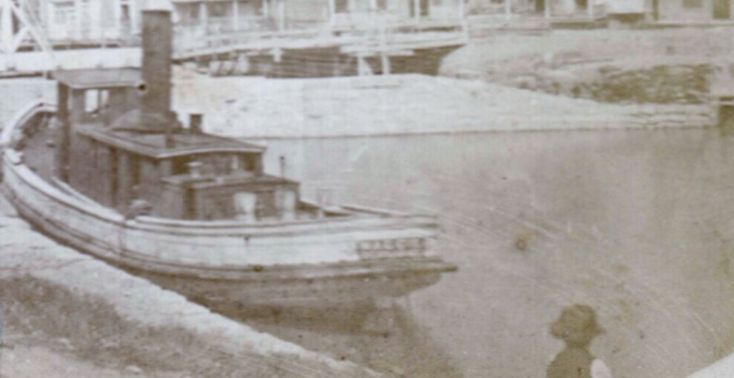 Tug boat in canal at Port Colborne in 1870s